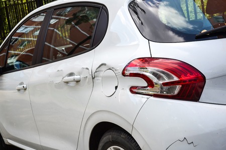 A car with a scratch on the body. Close-upのeditorial素材
