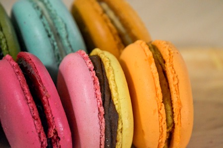 Homemade delicious macaroni cookies of different colors close-upの写真素材