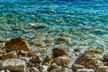 Sea. Large coastal rocks in the water near the shoreの写真素材