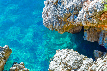 Nice view of the sea. Calm clear sea. Large stones. The Adriatic. Montenegroの写真素材