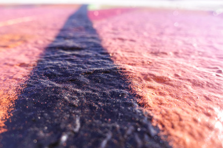 Concrete wall painted in red. Abstract background. Selective focus.の写真素材