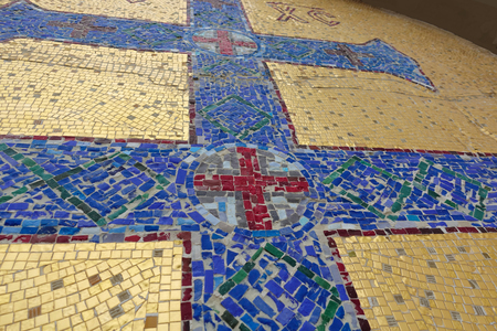 Mosaic image of the Orthodox cross with elements of vegetation. Blue cross on a golden backgroundの写真素材