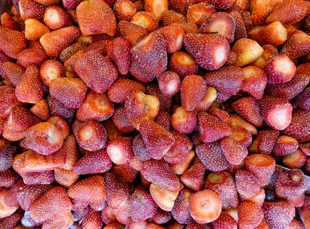 Frozen strawberries Red backgroundの写真素材