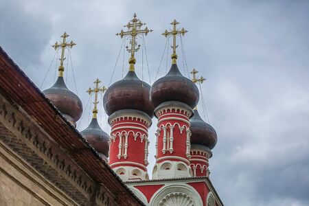 Eastern orthodox crosses on domes, cupolas, fog and cloudy weather.