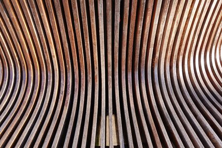Abstract background of brown wooden curves. Smooth bendsの写真素材