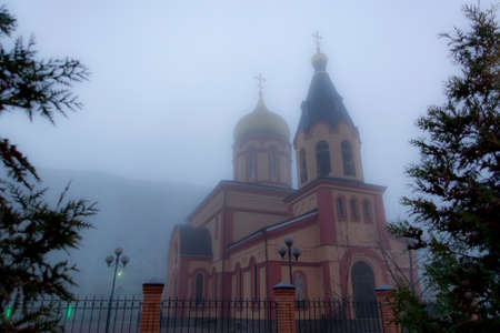 Christian church in the fog. Russia early morningの写真素材