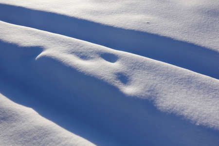 winter background. Snow and bumps. snow covered trackの写真素材