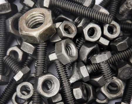 Bolts and nuts closeup on a white background.の写真素材