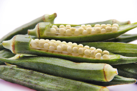 Fresh raw okra isolated on white backgroundの写真素材