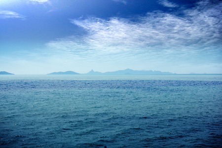 blue sea and cloudy sky over itの写真素材