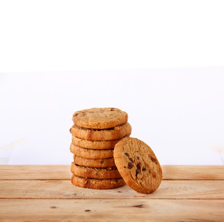 Chocolate Cookies and tea put on Wooden in White Background.の写真素材