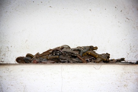 vintage golden keys are on white background.の写真素材
