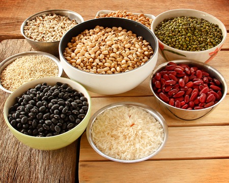 Different kinds of Grains, five grains put on wooden background.の写真素材