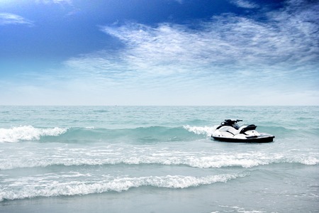 blue sea and cloudy sky over itの写真素材