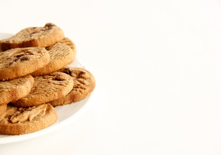 Chocolate Cookies and tea are on White Background.