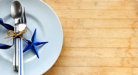 Tableware with white tag price and shiny blue star. Christmas concept.の写真素材