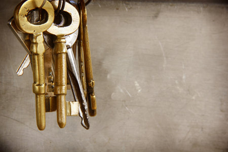 Vintage golden keys are on a white background for the mysterious, elegant vintage banner.の写真素材