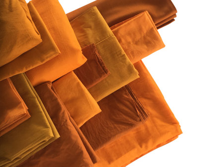 The Yellow robe in many Earth tones for the monk. The yellow fabric of a Buddhist Monk or A Buddhist Novice. Texture and Background Concept.の写真素材