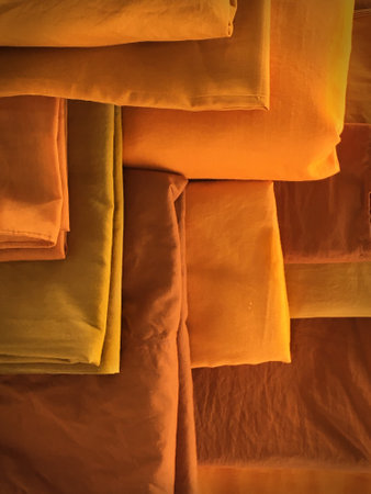 The Yellow robe in many Earth tones for the monk. The yellow fabric of a Buddhist Monk or A Buddhist Novice. Texture and Background Concept.の写真素材