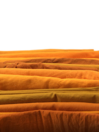 The Yellow robe in many Earth tones for the monk. The yellow fabric of a Buddhist Monk or A Buddhist Novice. Texture and Background Concept.の写真素材