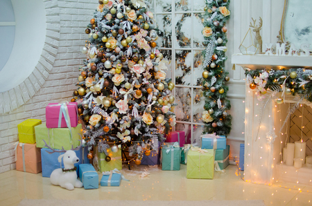 Christmas tree with presents in the interiorの写真素材