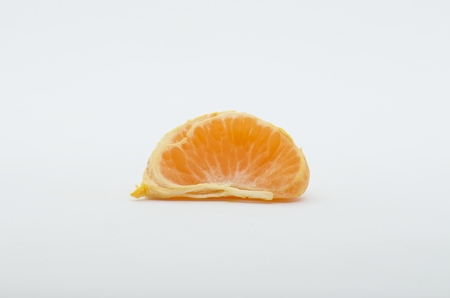 Tangerine over whte background shotsの写真素材