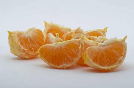 Tangerine over whte background shotsの写真素材