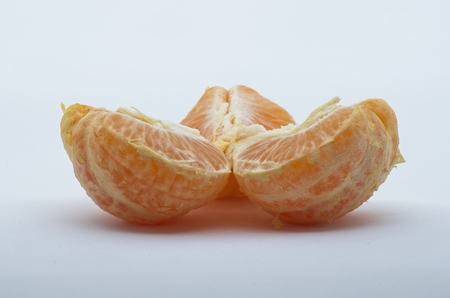 Tangerine over whte background shotsの写真素材