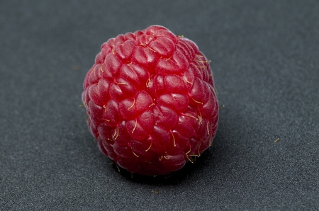 Raspberries over black backgroundの写真素材