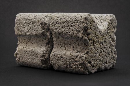 grey concrete spacers isolated on black backgroundの写真素材