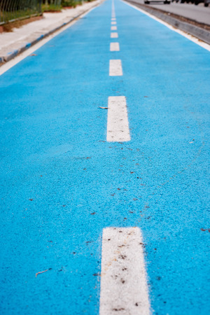 Blue cycle path along the coast Terracina, Italyの写真素材