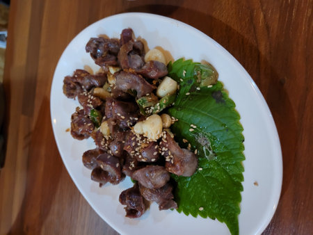 Stir fried pork with spicy sauce on white plate, Thai foodの写真素材
