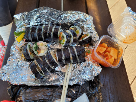 Sushi rolls on a wooden table, closeup of photo.の写真素材
