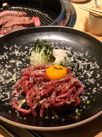 Beef tartare with egg yolk and grated parmesanの写真素材