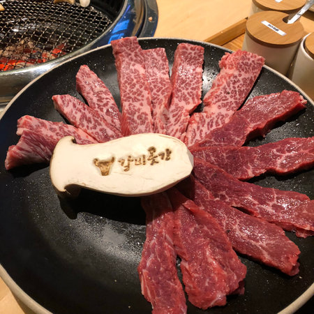 Raw beef sliced on a hot pan. Shabu Shabuの写真素材