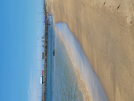 View of the beach and the pier from the height of the bird's flight