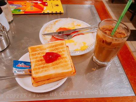 Toast and ice coffee in the coffee shop at Bangkok, Thailandの写真素材