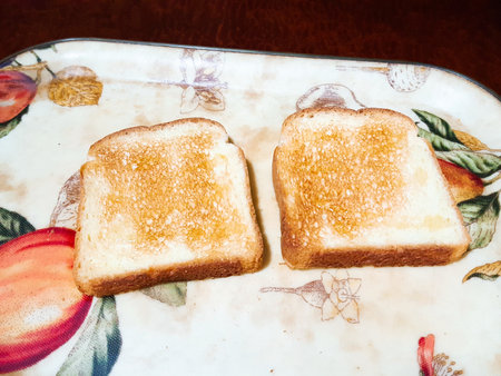 Sliced toast bread on a plate, closeup of photoの写真素材
