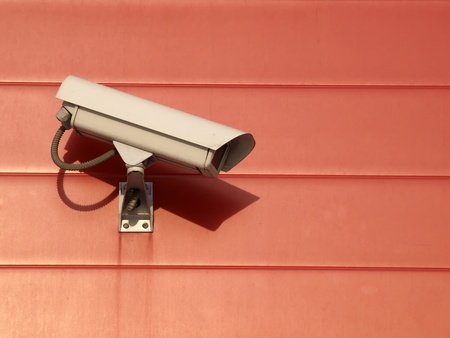 Security camera on the red wall の写真素材
