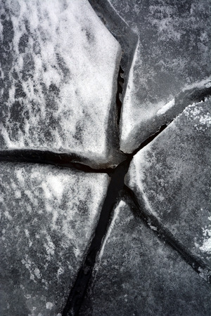 Cracked ice. Picture can be used as a backgroundの写真素材