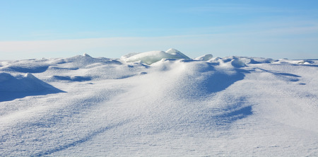 Polar landscape- frozen sea with blue sky background