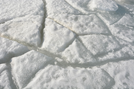 Cracked ice. Picture can be used as a backgroundの写真素材