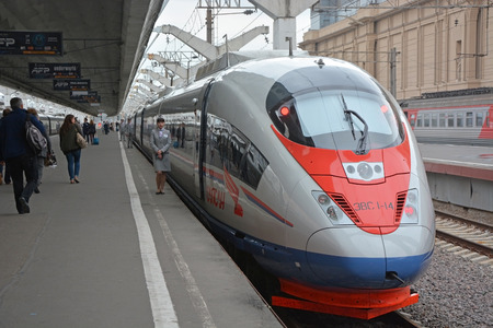 SAINT-PETERSBURG, RUSSIA - JUNE 24: Passengers boarding the train sapsan at the Saint-Petersburg on...