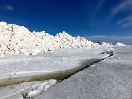 Ice hummocks on the coast of the Gulf of Finland in the spring (winter) season. Zelenogorsk, St....