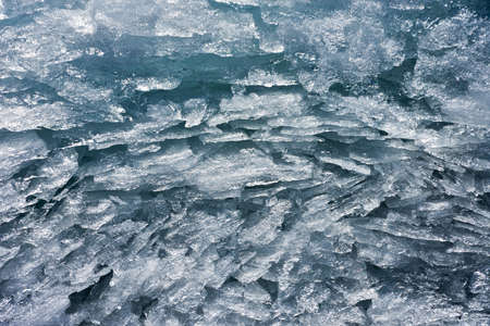 Background from broken pieces of ice. texture, pattern, closeup
