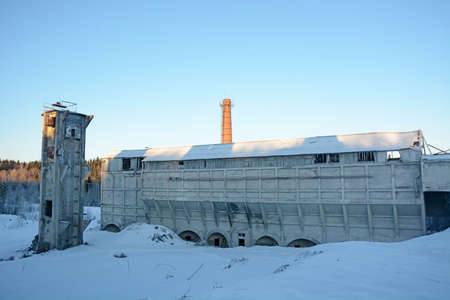 Remains of an abandoned marble and lime factory in Ruskeala, Republic of Karelia, Russia. Tall brick chimneys in the winter seasonの写真素材