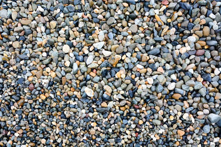 Pebbles at the sea shore backgroundの写真素材