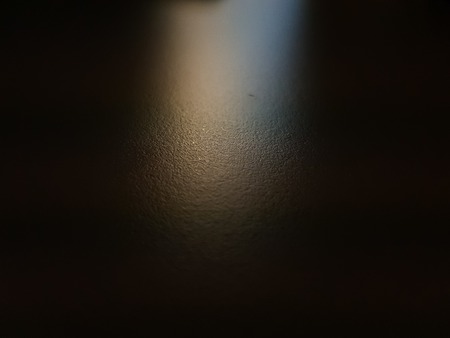 A yellow blue ray of light shining on to a surface