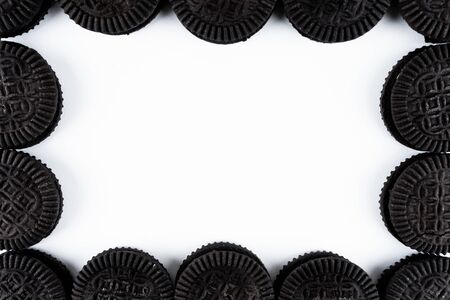 A frame made of sandwich cookies on white backgroundの写真素材