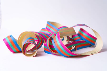 A paper streamer laying on white background - close upの写真素材